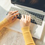woman hand on computwe keyboard on desk